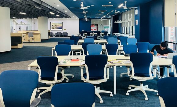 Modern library seating area with comfortable chairs and study tables